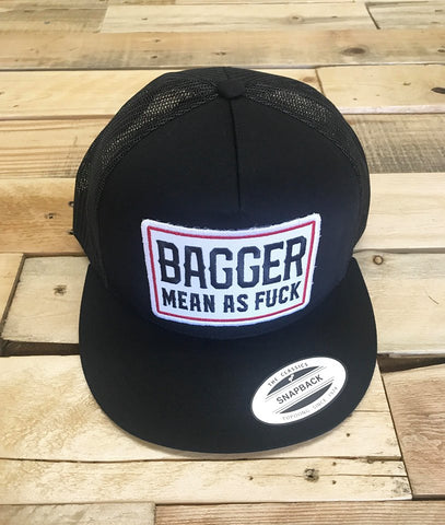 Black trucker cap with 'Bagger Mean as Fuck' text on a wooden surface