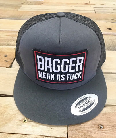 Gray trucker cap with 'Bagger Mean as Fuck' text on a wooden surface