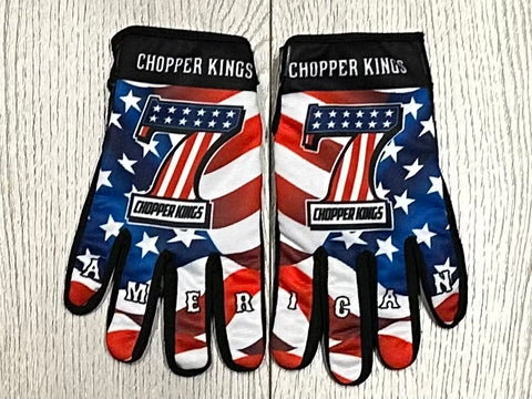 Pair of gloves with American flag design and 'Chopper Kings' branding on a wooden surface.