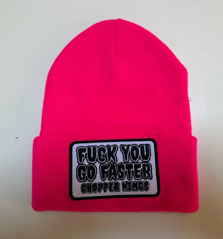 Pink beanie with a black and white patch on a light gray background
