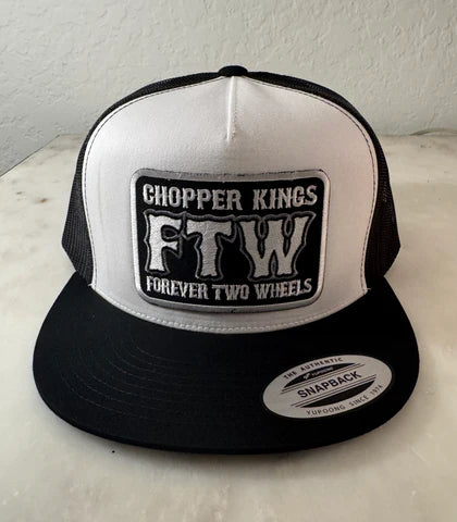 Black and white cap with 'Chopper Kings FTW Forever Two Wheels' logo on a light surface.