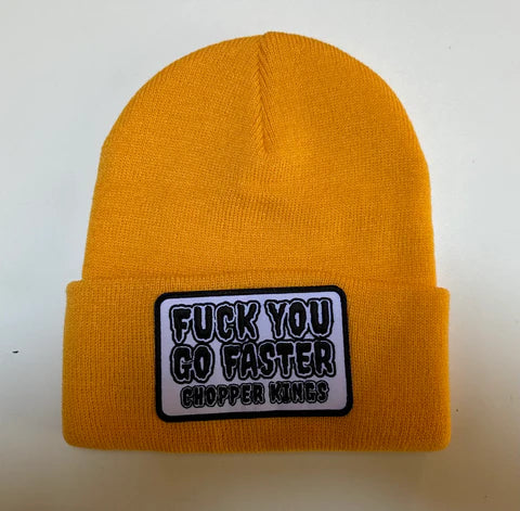 Yellow beanie with a patch on a white background