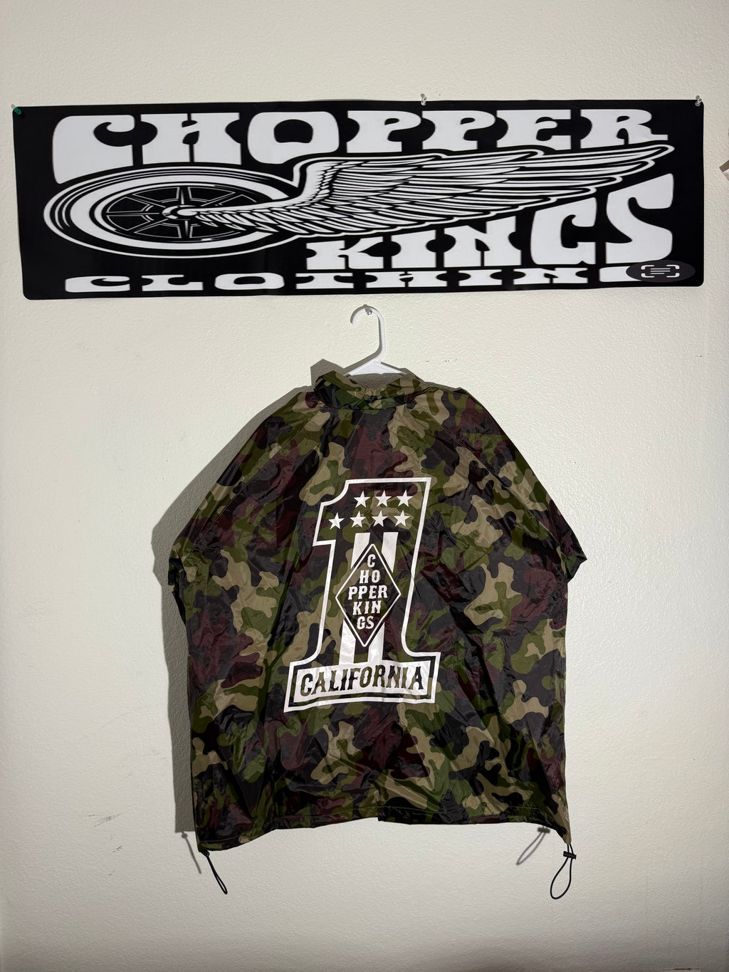 Camouflage drawstring bag with brand logo on a white background