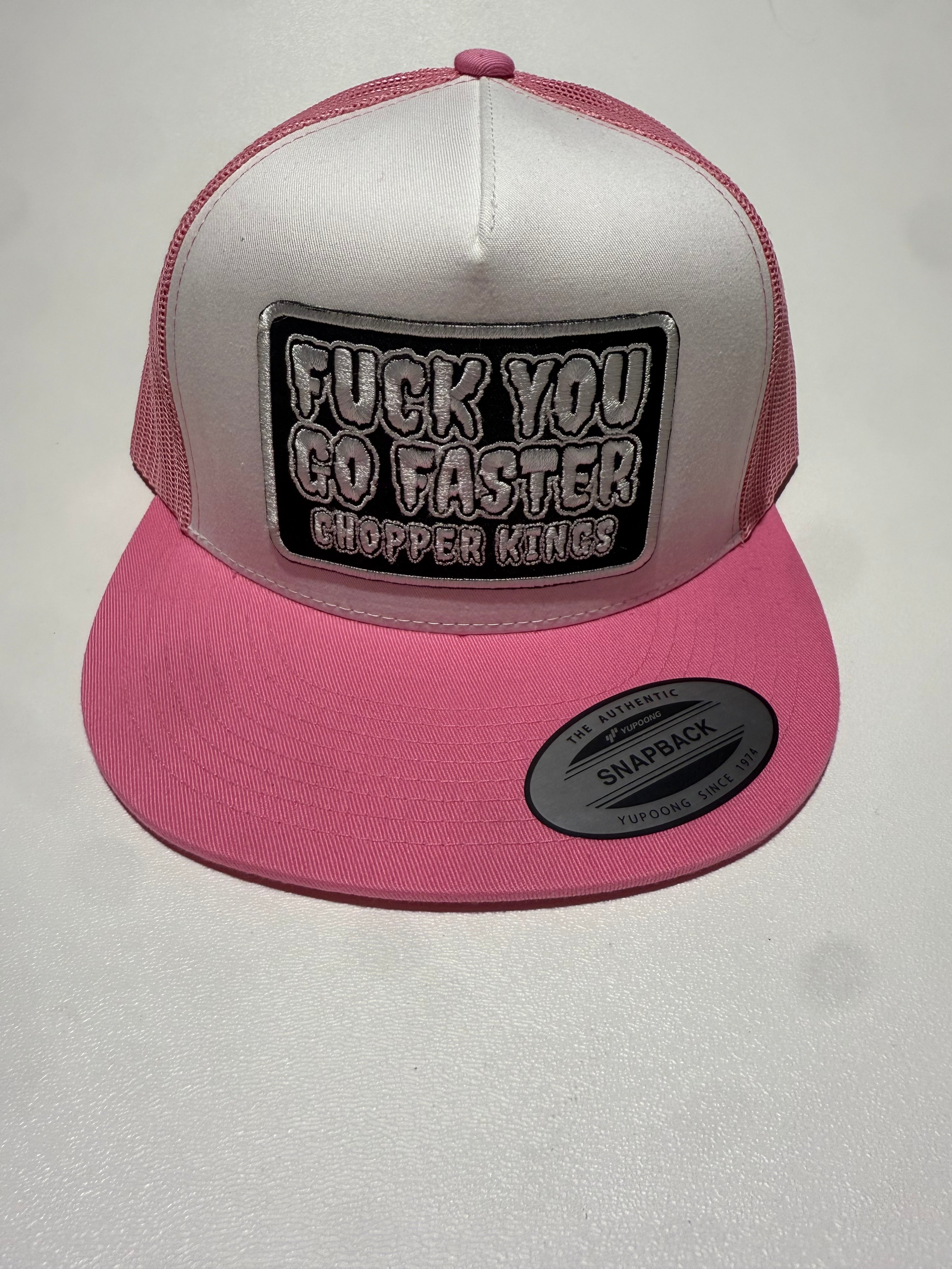 Pink cap with a white interior and a black and white text logo on a light gray background