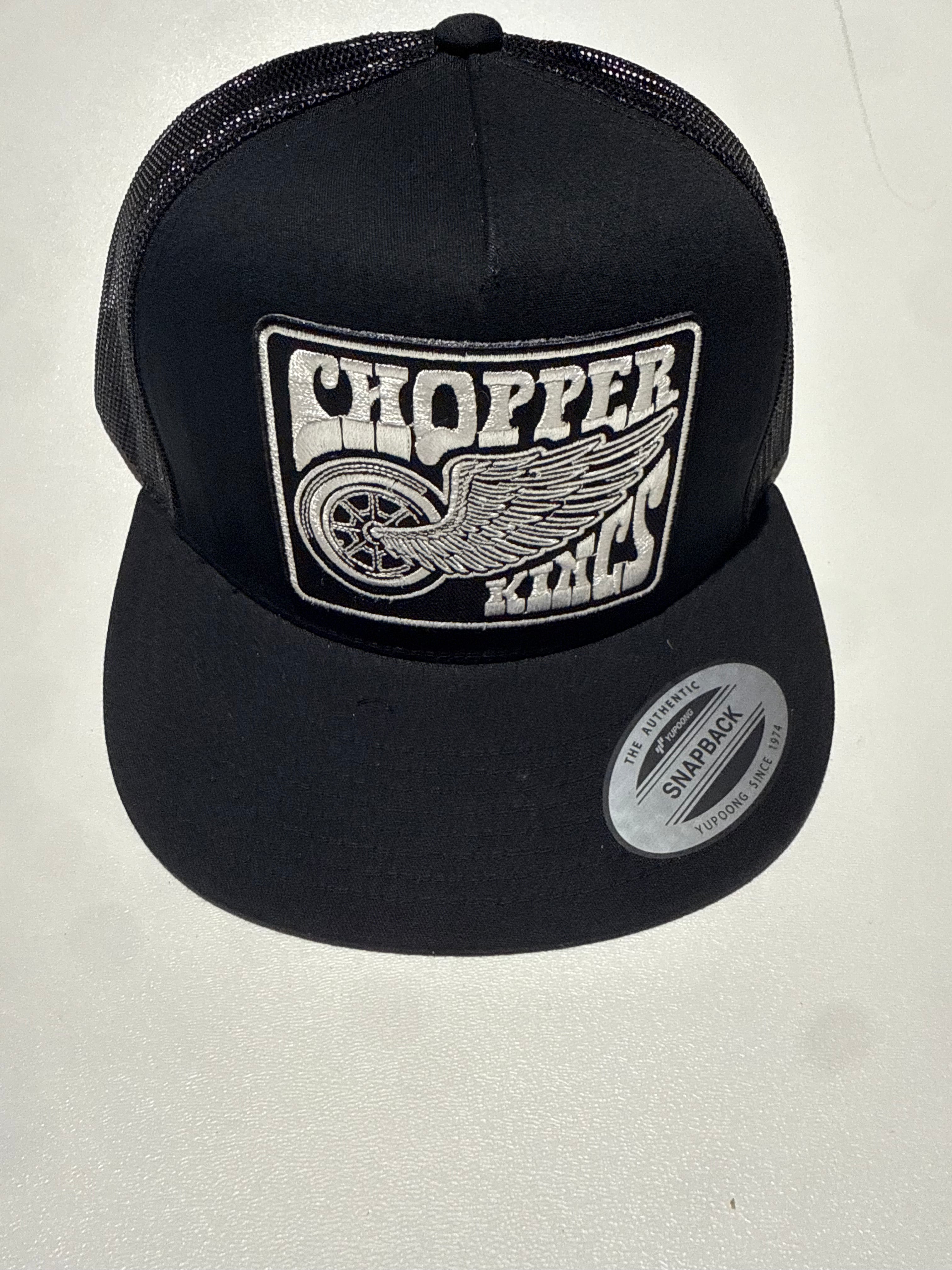 Black cap with a logo on a light gray background