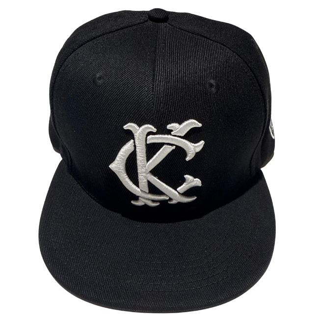Black cap with a silver logo on a white background