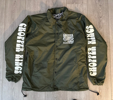 Green jacket with 'Chopper Kings' branding on a wooden floor