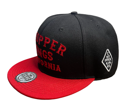 Black and red cap with 'Copper Kings' branding on a white background