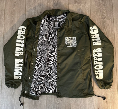 Green jacket with 'Chopper Kings' branding on a wooden floor