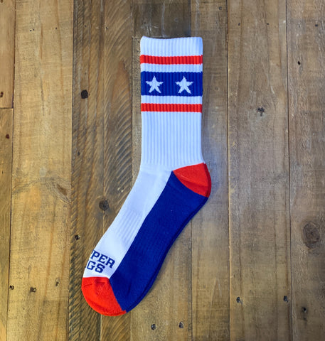 White sock with blue and red accents on a wooden surface